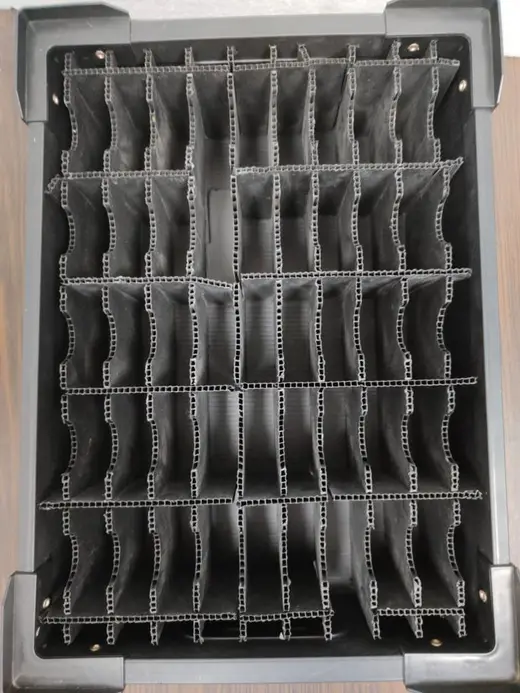 PP corrugated ESD bin seen from above, twin-wall dividers forming a matrix of individual component compartments, EMS Technologies